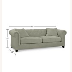One stunning, full size grey couch tufted