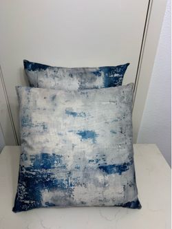2 blue pillows