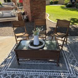 All Weather Resin Wicker Coffee Table with Storage and (3) Folding Strathwood Wooden Folding Chairs
