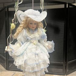 Vintage Porcelain Doll In Swing
