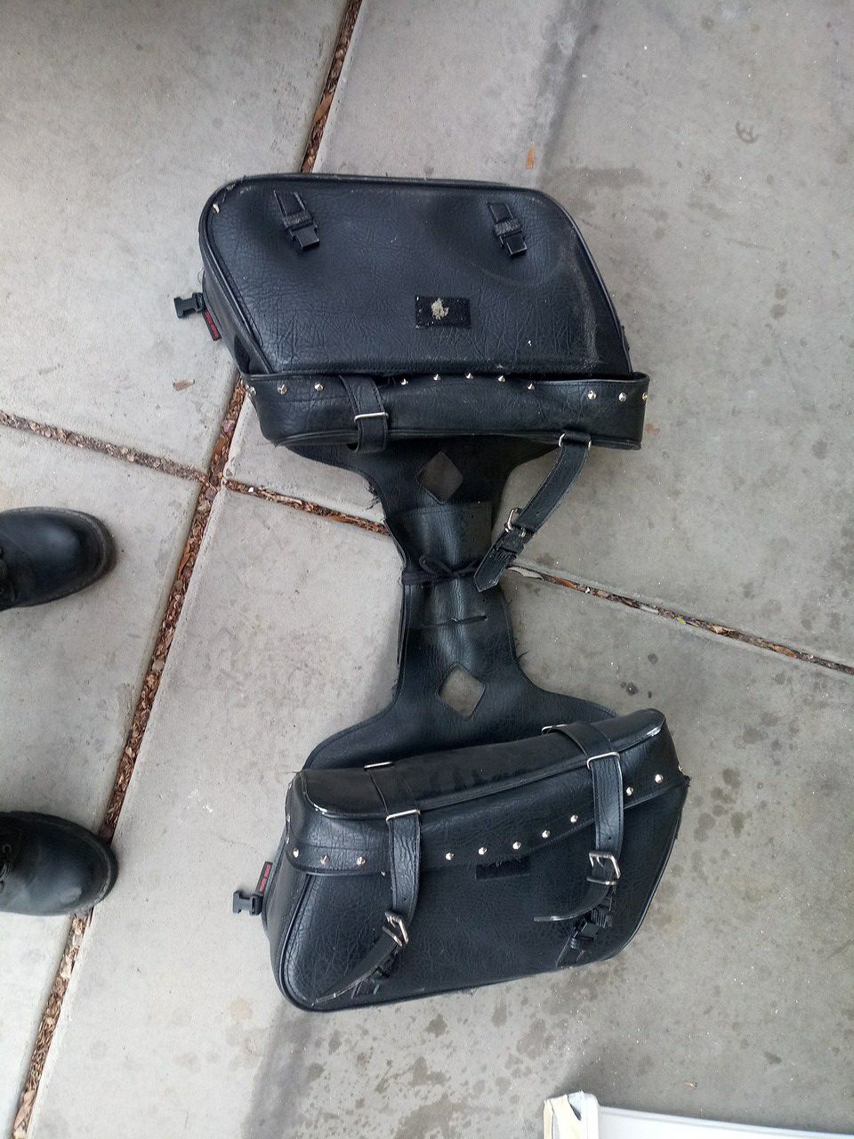 Saddle bags, damage from sitting on pipe. Used a couple times