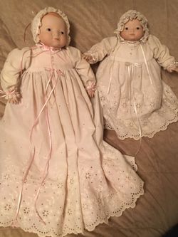 Two baby dolls in Christening gowns