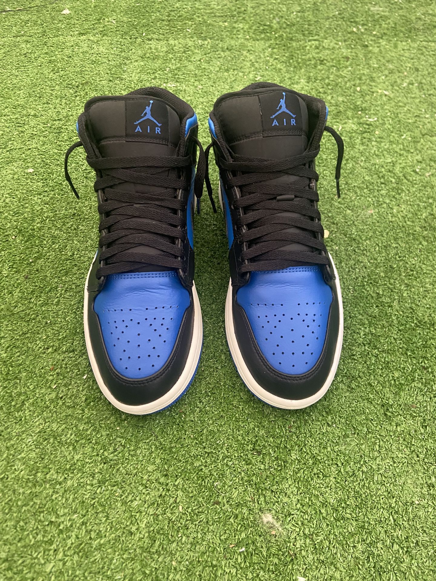 black and royal blue Air Jordan 1s