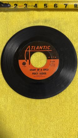 This item is a collectible vintage 7-inch 45 RPM vinyl single featuring the song "Heart of a Child" by soul singer Percy Sledge. 
