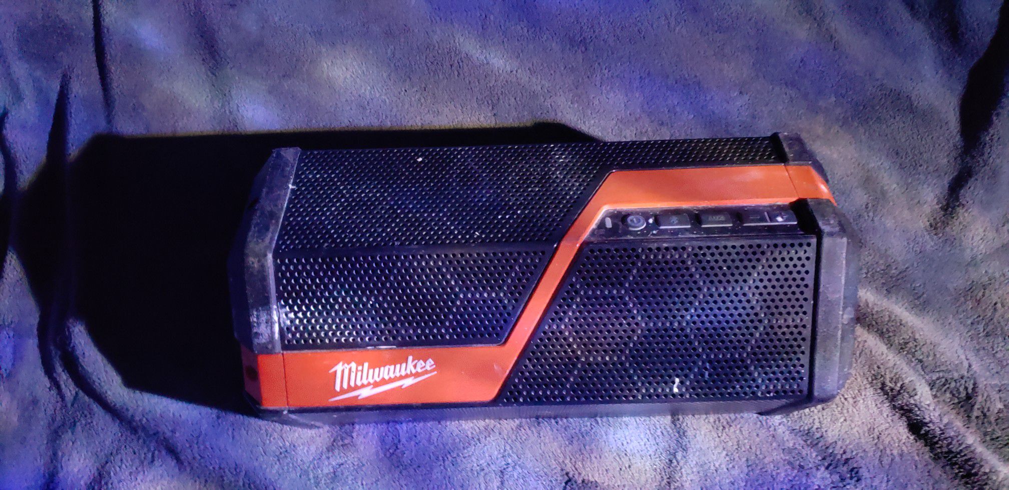 Milwaukee Radio with Red Ion Battery and Charger.
