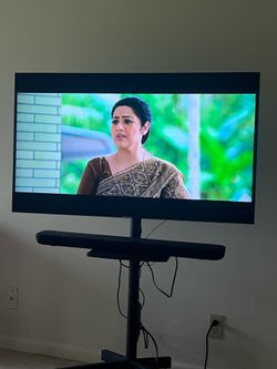 TV, Speaker and Rolling stand bundle