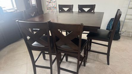 Dark wood counter height dining table with 6 chairs