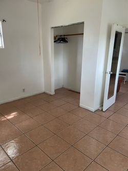 1 bedroom  1 bath free standing cottage large yard fenced and 1  parking space uncovered