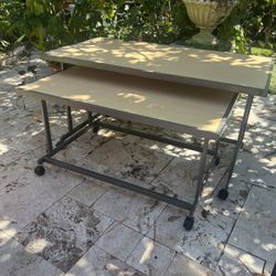 Nesting tables on rollers. Commercial tables that are good for home hobbies.