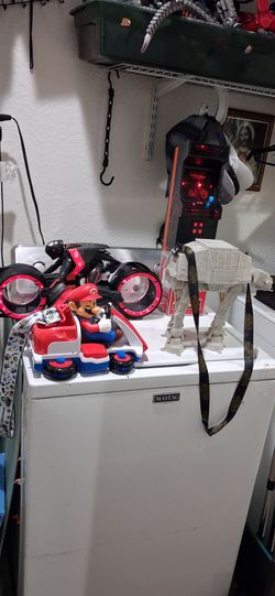 Popcorn Bucket set . Good condition.  -Red and white Super Nintendo  world Mario kart light-up.   - Disney Parks  star wars AT-AT  walker.  -  Tron Ar