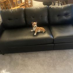 Black soft Naugahyde couch