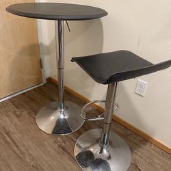 Airlift adjustable pub table and stool