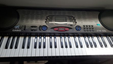 Casio 100 song keyboard with stand.