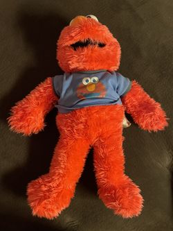 Elmo stuffed animal with Elmo shirt and functional talk button