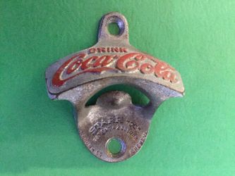 Wall mount Coca Cola bottle opener.
