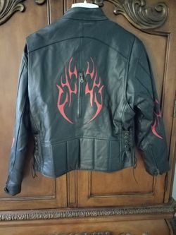 Womens leather motorcycle jacket with matching leather shoulder bag. Size medium. Very good condition.