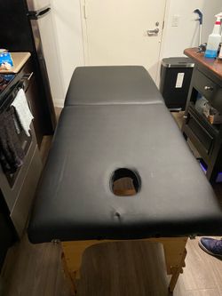 Black leather massage table
