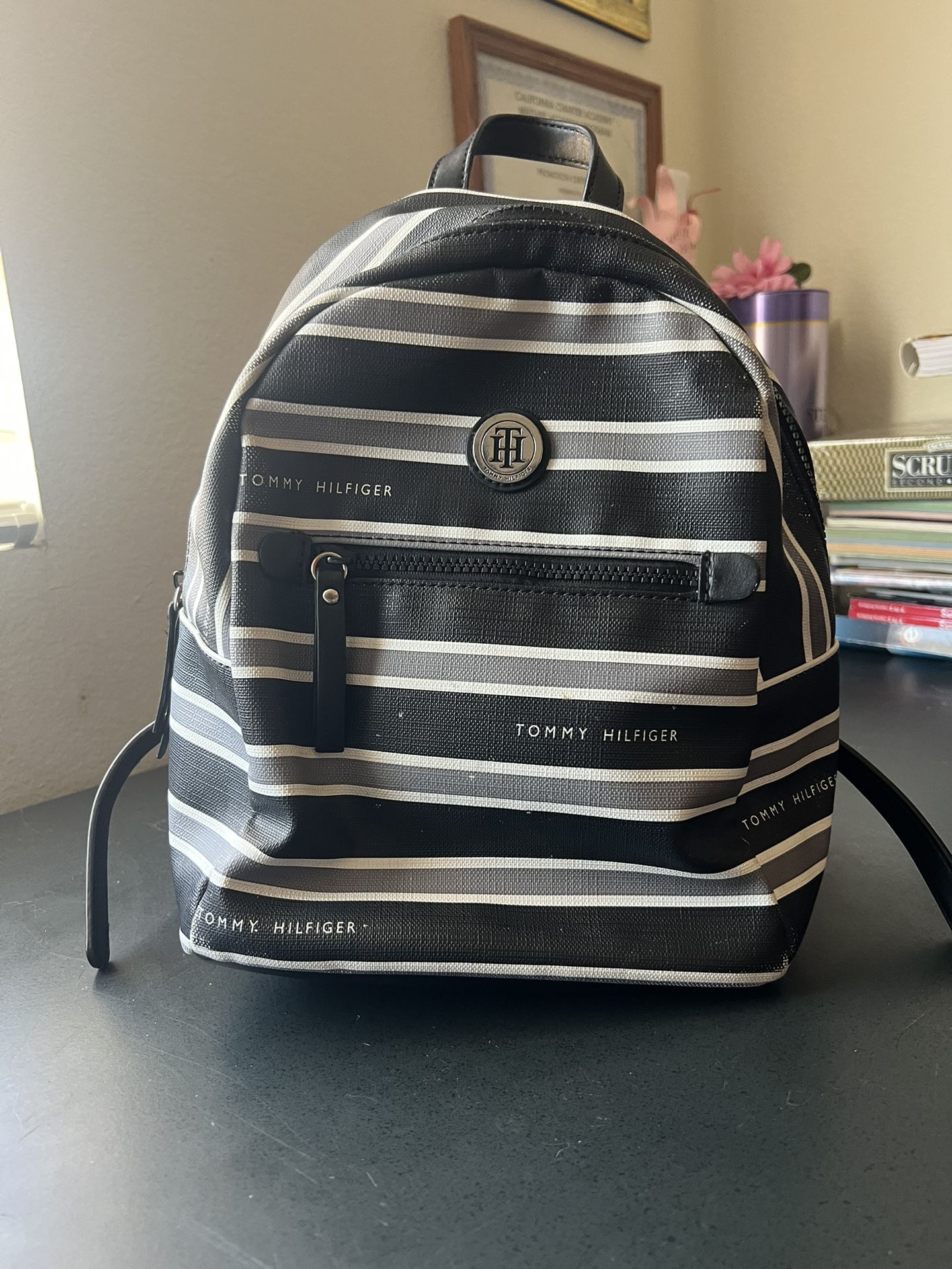 Tommy Hilfiger Small Backpack Striped Shoulder Black & White Bag is pre-owned, condition is good. Inside of bag in great condition. Please view all p