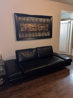 Sofa bed and painting