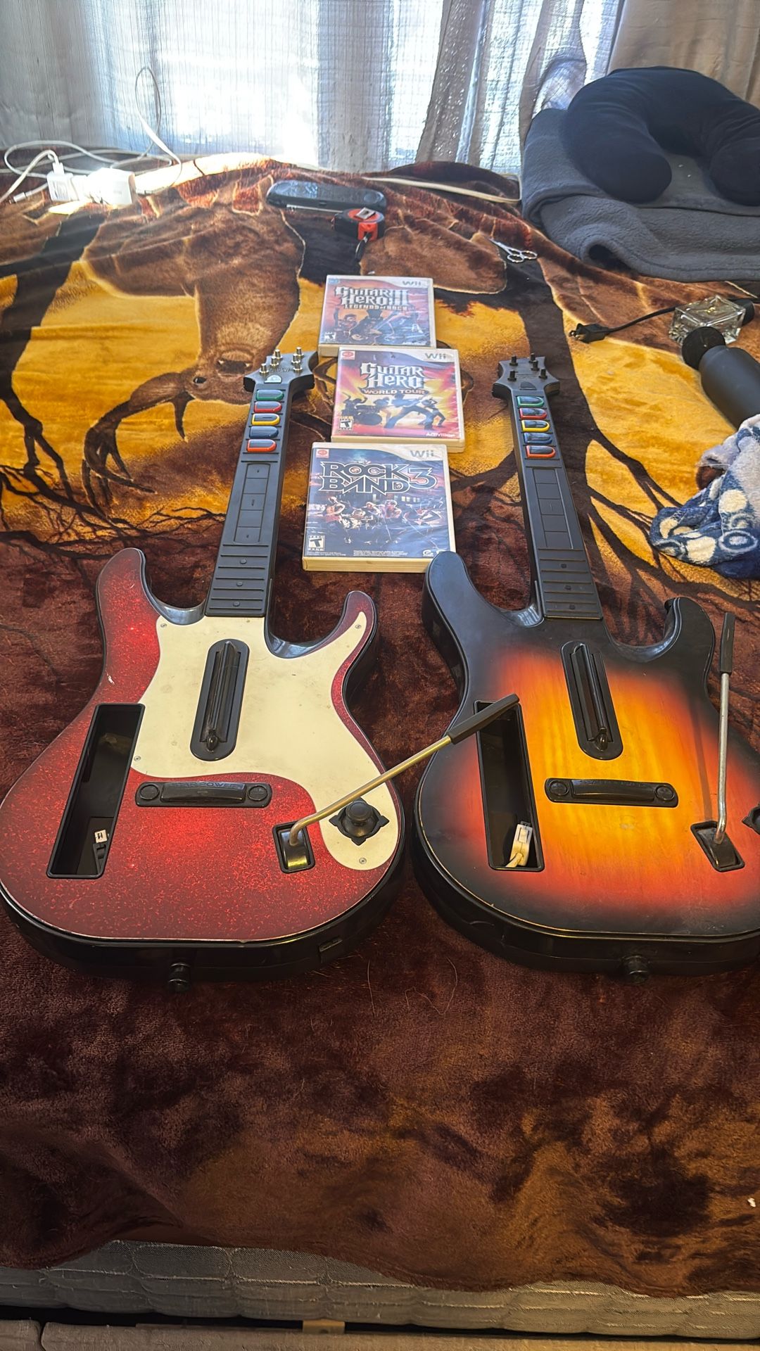 2 Guitar Hero Guitars And 3 Games