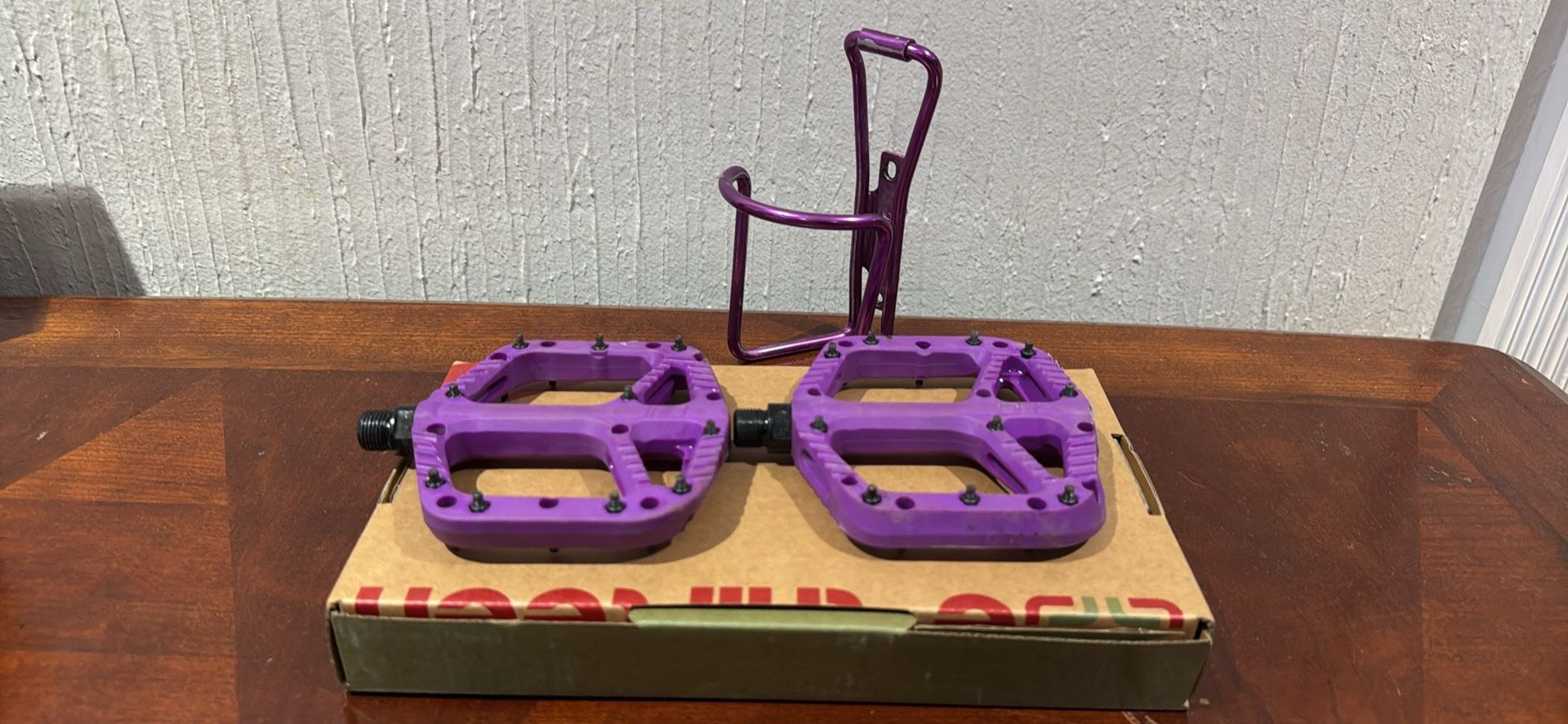 Purple One up bike pedals and aluminum Specialized bottle holder