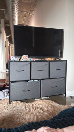 TV stand with grey pull out drawers