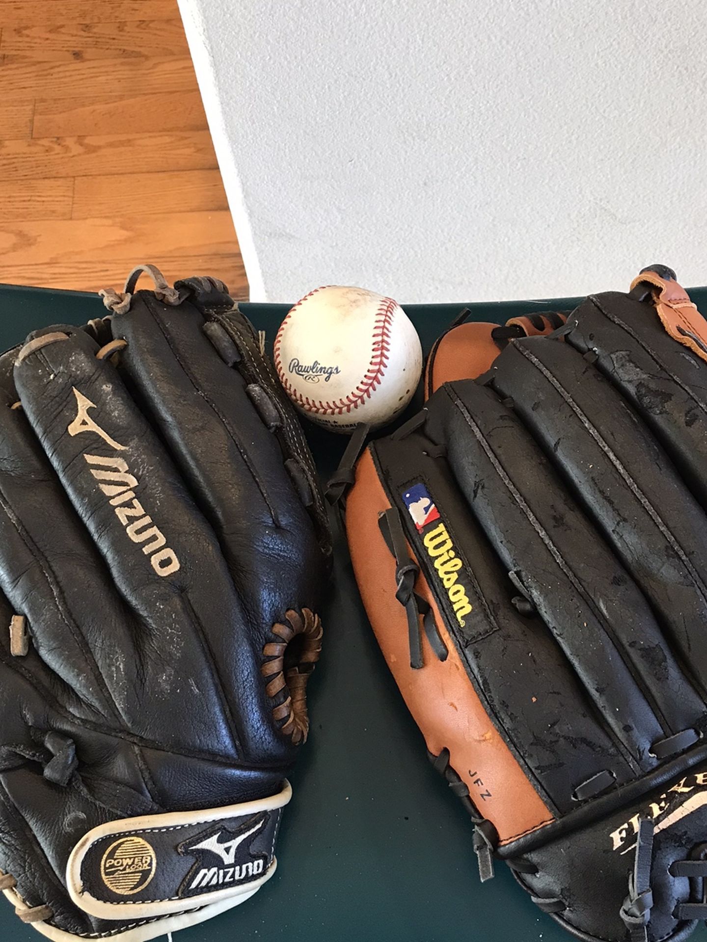 2 Baseball Gloves With Baseball