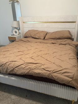 White Upholstered Bed Frame with Gold Accents King size
