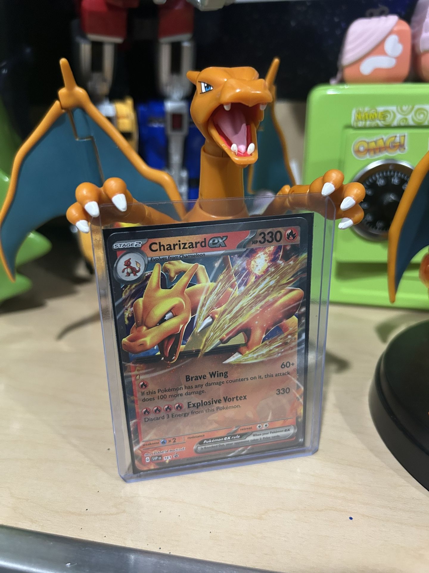 Pokémon card and two Charizard
