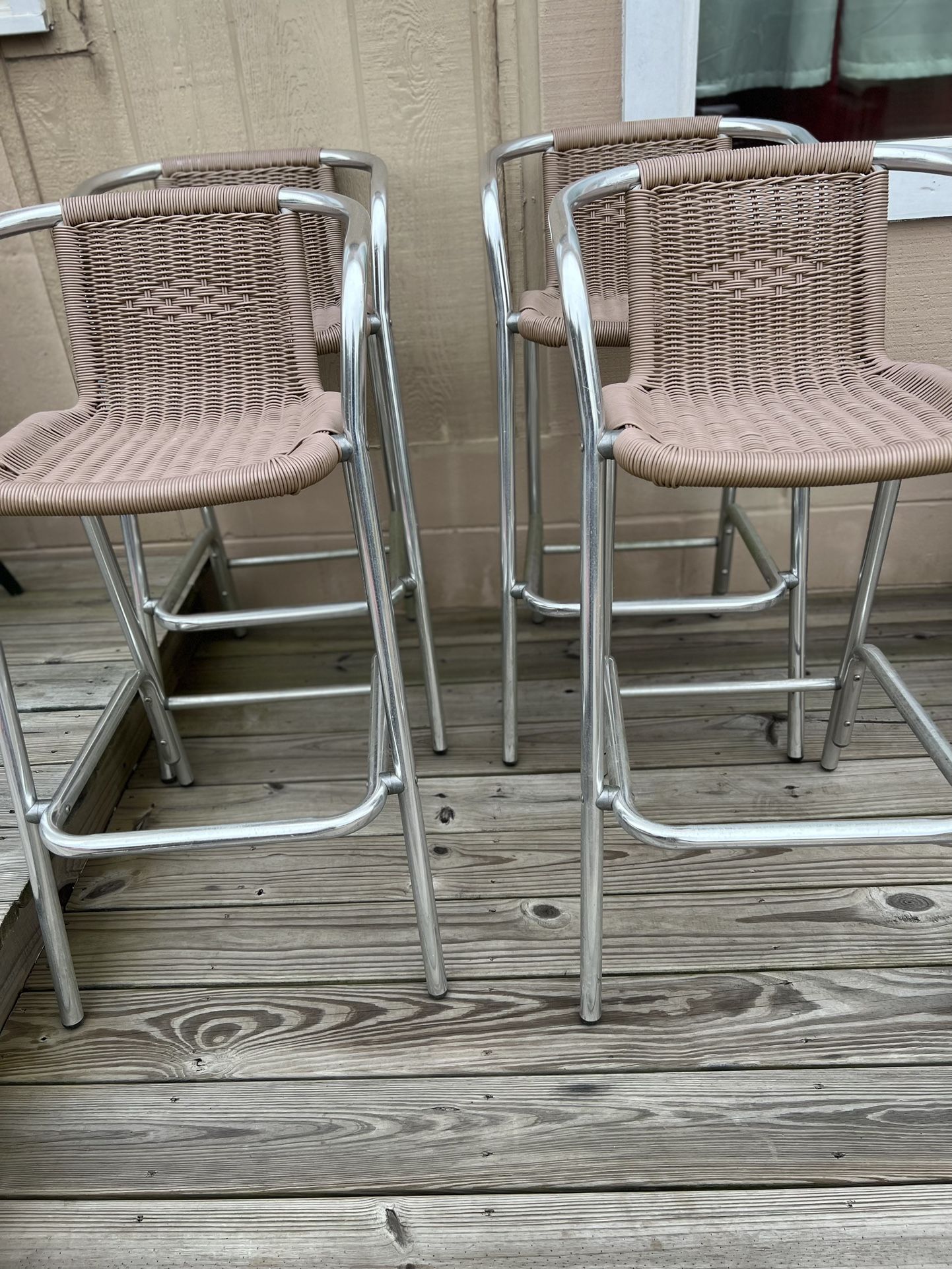 Barstools. Set of 4. Aluminum/vinyl wicker style. Stools sets 30 from floor. Very good condition. 