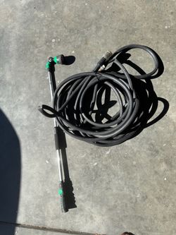 Large rubber garden hose and watering wand