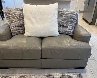 Gray leather sofa and loveseat