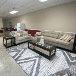Sofa and loveseat and three coffee tables