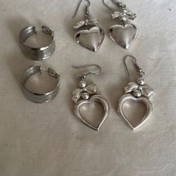 Silver Earrings With The Heart Designs 