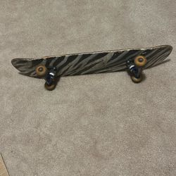 Skateboard with venture trucks and red bearings