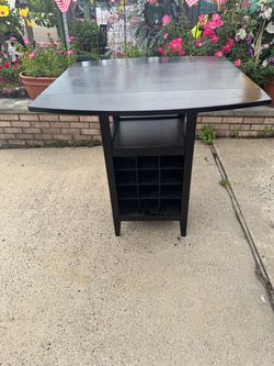 Black Drop-Leaf Dining Table with Built-In Wine Rack