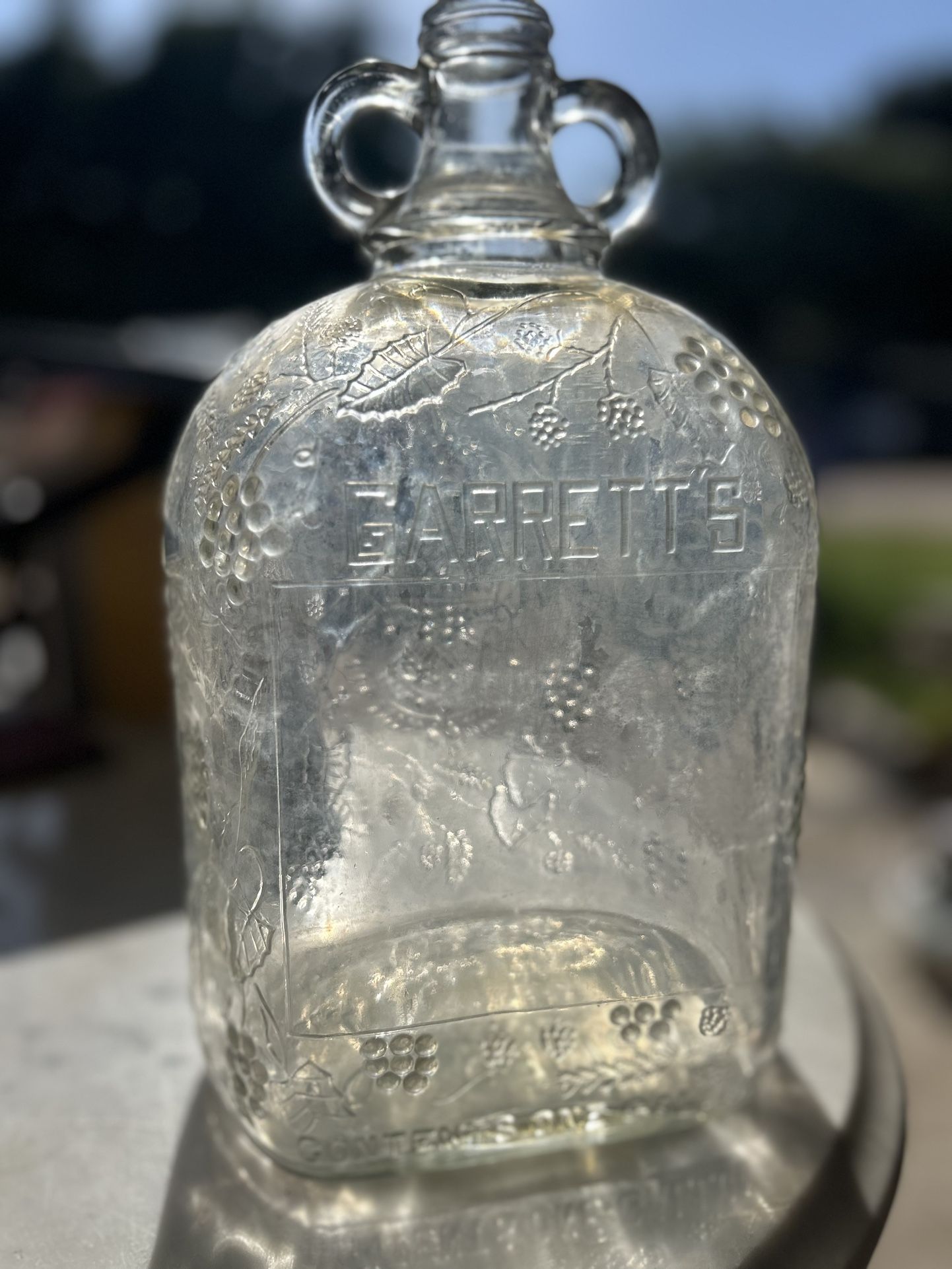 Antique Embossed Garrett’s American Wines Glass Jug