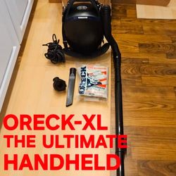 PRE-OWNED JUST LIKE NEW ORECK-XL LIGHTWEIGHT HANDHELD VAC(with shoulder strap)