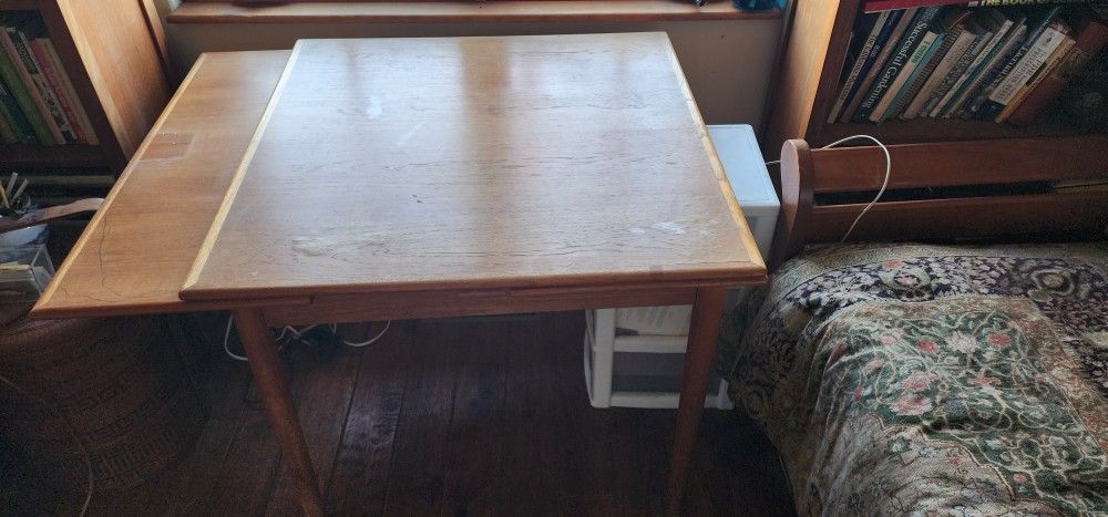 Wood Table in Nice Shape 33" X 33" has Extensions On Both Ends Adds 12" To Both Ends. $20 OBO.