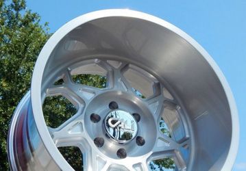 On Sale. 20x12 6x135 Machine Silver wheels & 33x12.50-20 tires (We Finance….