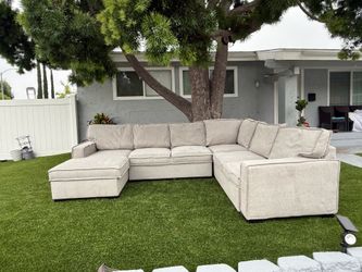 Light Gray U-Shaped Sofa with Storage Chaise (Converts to a Bed)