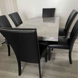 Beautiful Dinning set Marble Table w/6 leather chairs 70in long x 42 in wide