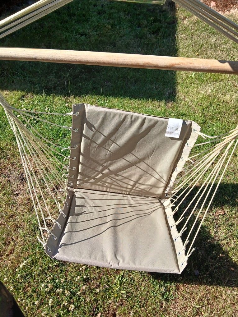 Tan And Black Hanging Swing Chairs
