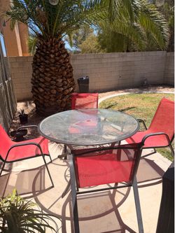 Outdoor patio table all glass with four chairs