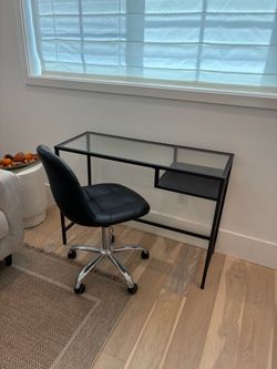 Glass table with matching leather chair