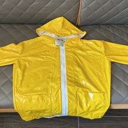 Yellow raincoat for women . Italy