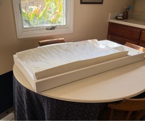 Baby changing station with changing pad