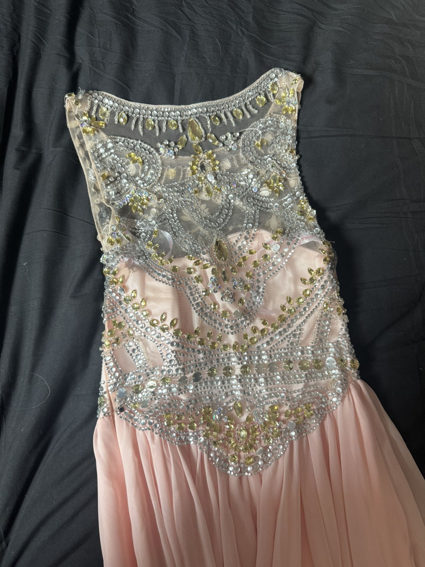 Blush pink embellished formal dress with sheer beaded bodice and flowy tail