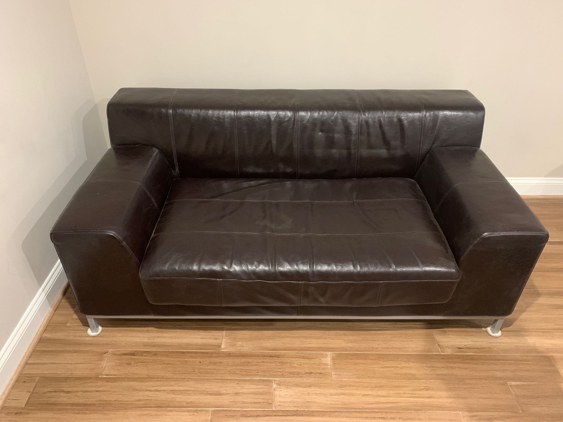 70 Inches Long/ 38 inches Wide Depth 27 inches. Real Italian leather loveseat espresso brown. Cool love seat for amazing price.