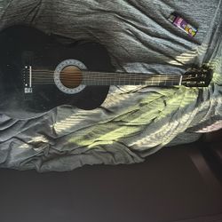 A black beginners guitar